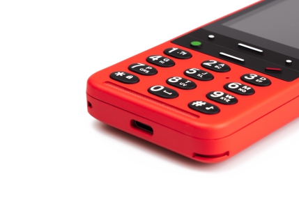 Numerical buttons on red phone.